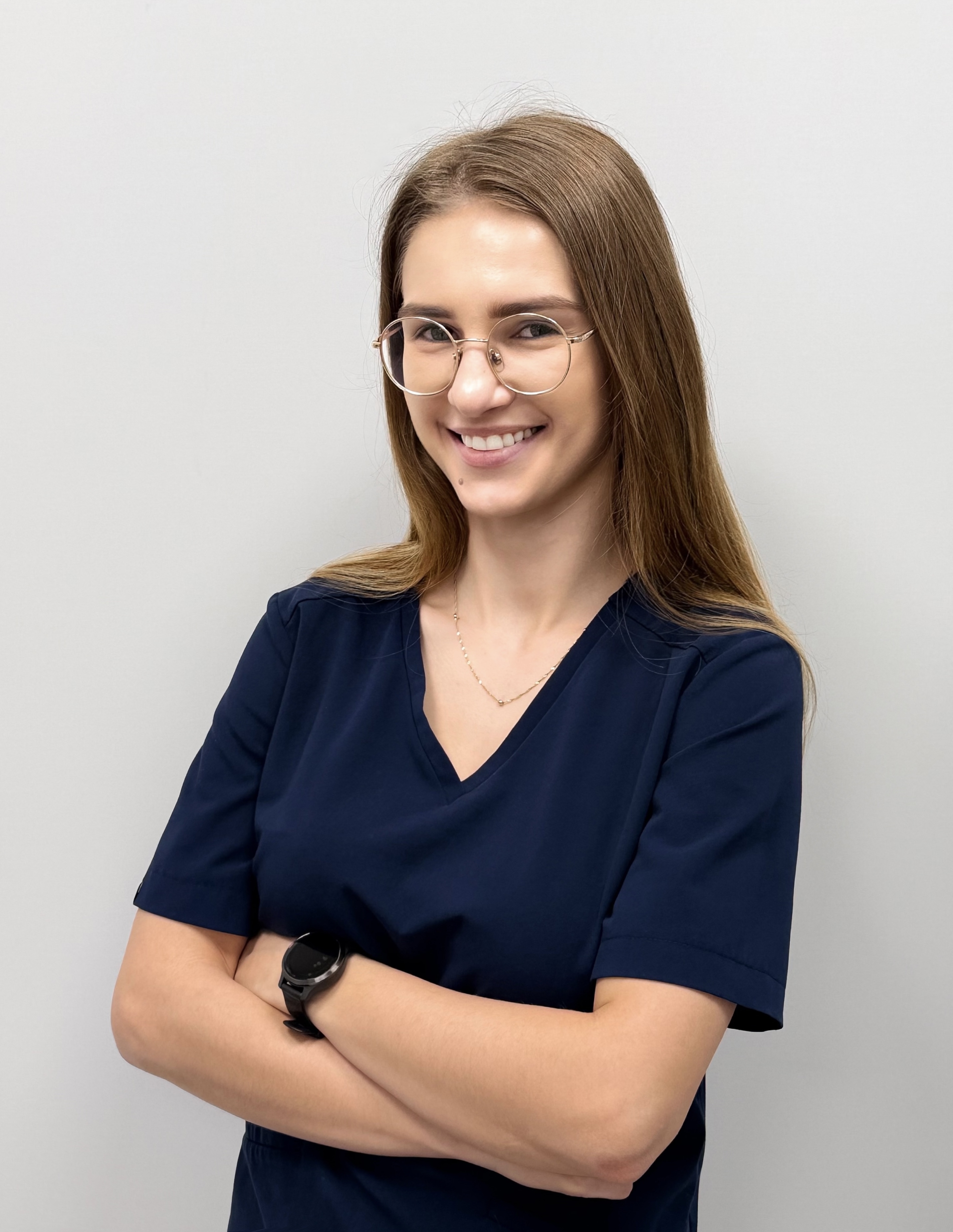 MultiMedica Stargard team member in clinic scrubs